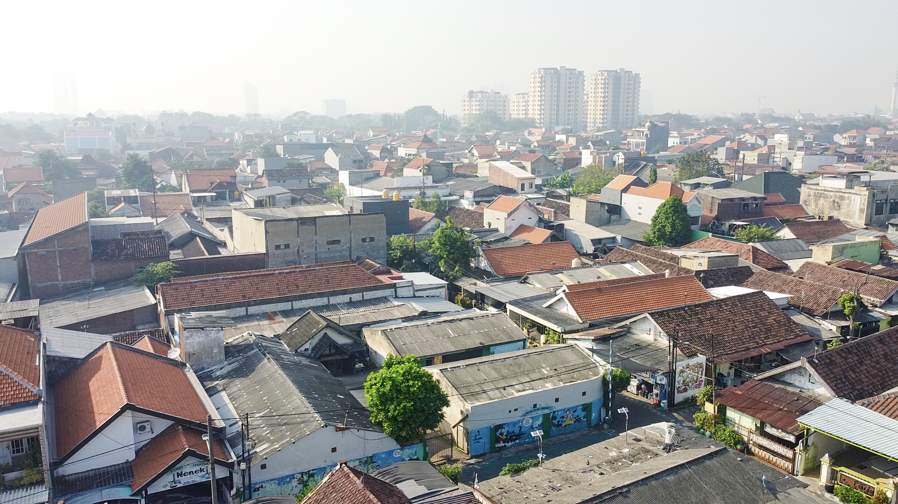 Aerial view of urban residential area with buildings and trees